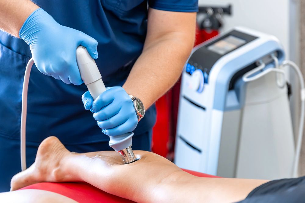 A person receives ESWT at a Roselle chiropractic clinic. 