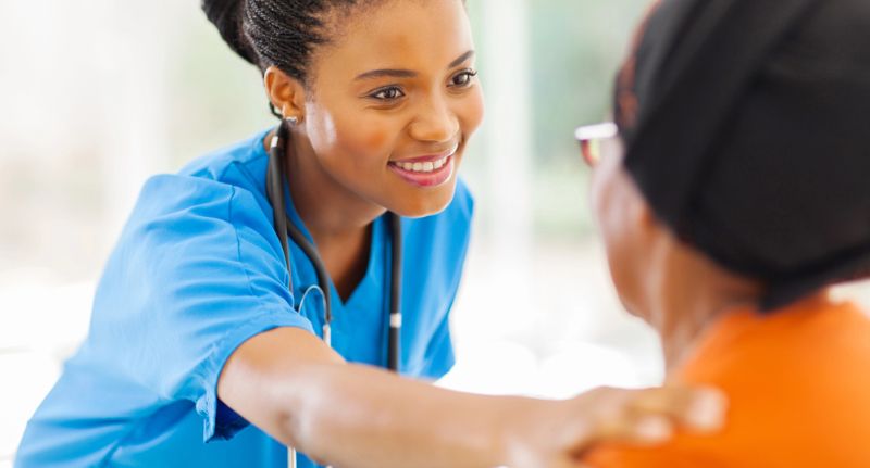 A nurse reaches out to comfort a patient after a personal injury.